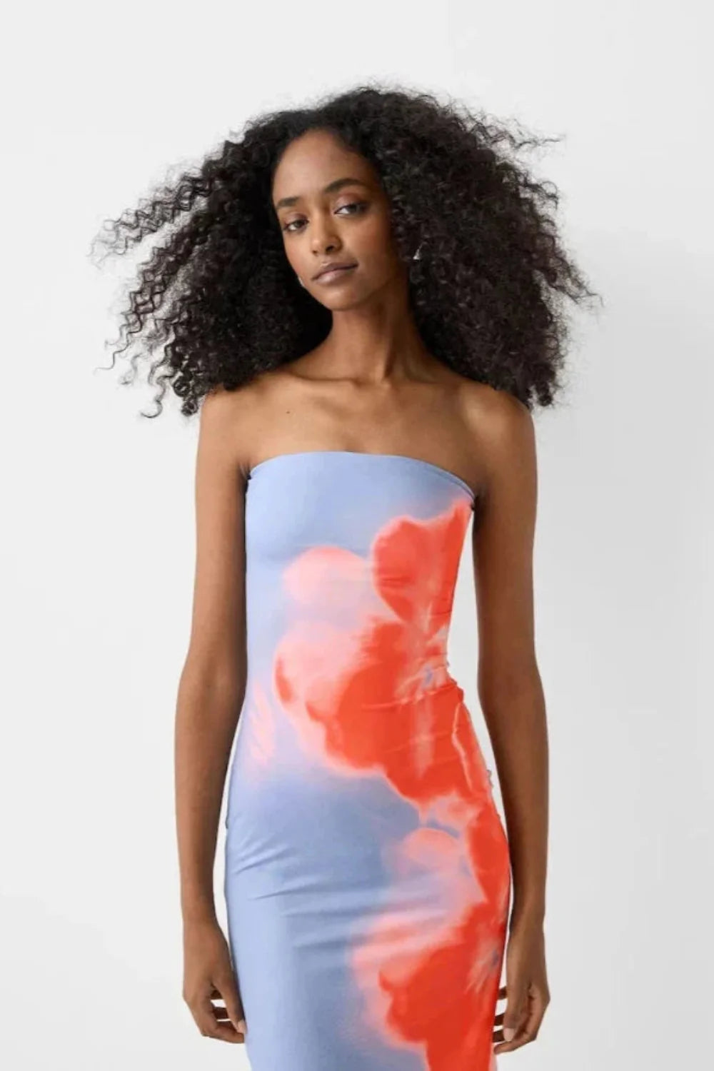 sculpting," "silhouette," "artistic," "vibrant hues," "resort-ready," "evening affair," "statement piece," "stretch-jersey," and "ankle-length
