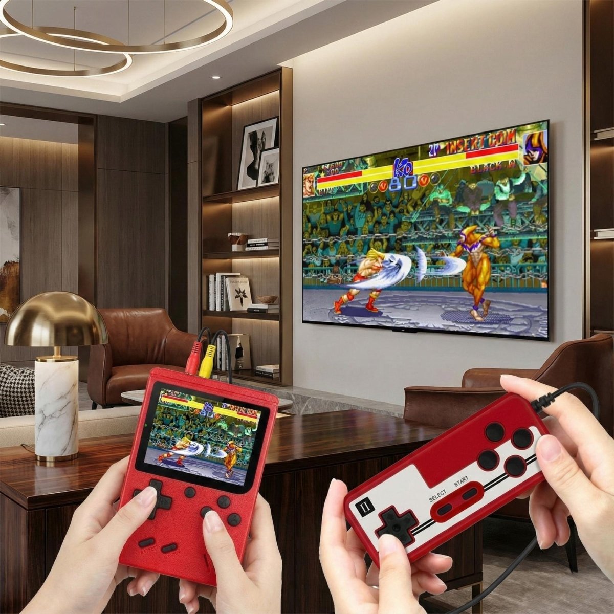 Two people playing a fighting game on a large TV, each holding a Kouvr red handheld console and controller.