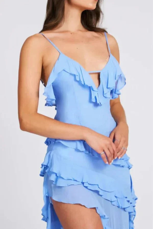 Model wearing Kouvr Aiah light blue asymmetric ruffle midi dress for a cocktail event