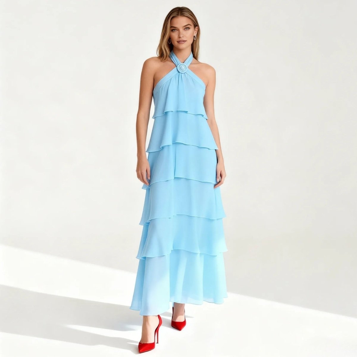 Light blue Kouvr tiered dress worn by a model on a white background