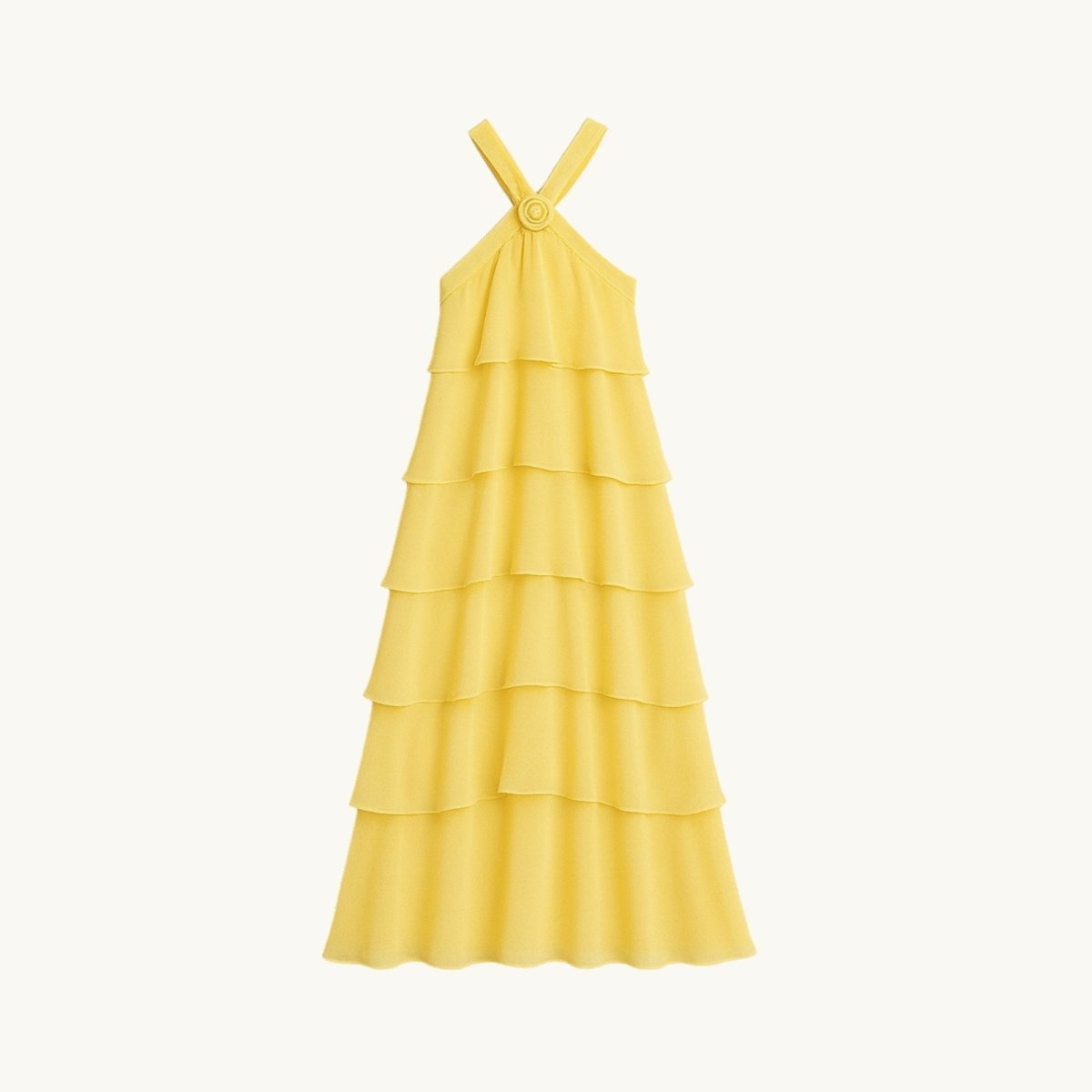 Yellow Kouvr tiered dress on a white background