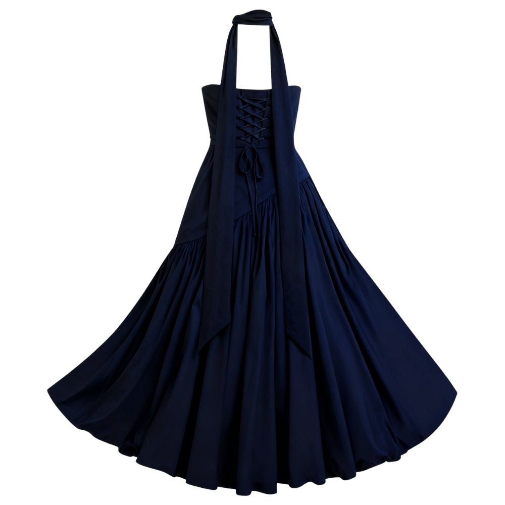 Navy Kouvr dress with halter neck and layered skirt on a white background
