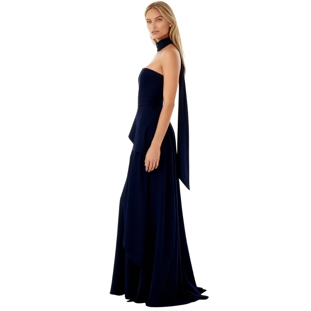 Navy Kouvr evening gown with a cape on a white background