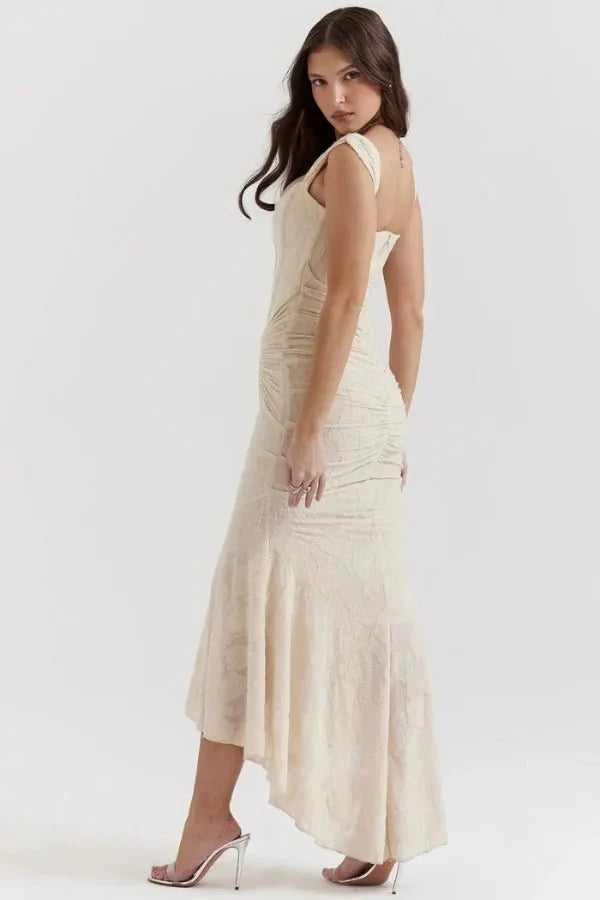 Model wearing the Kouvr Arabella ivory corset midi dress with asymmetrical hem