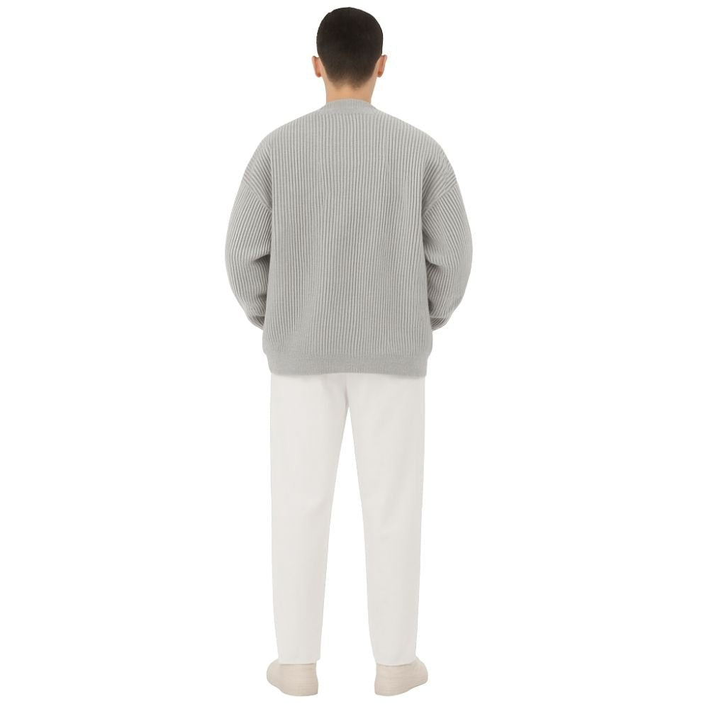 collarless bomber jacket," "minimalist sweater jacket," "quiet luxury knitwear," "structured knit," "transitional outerwear