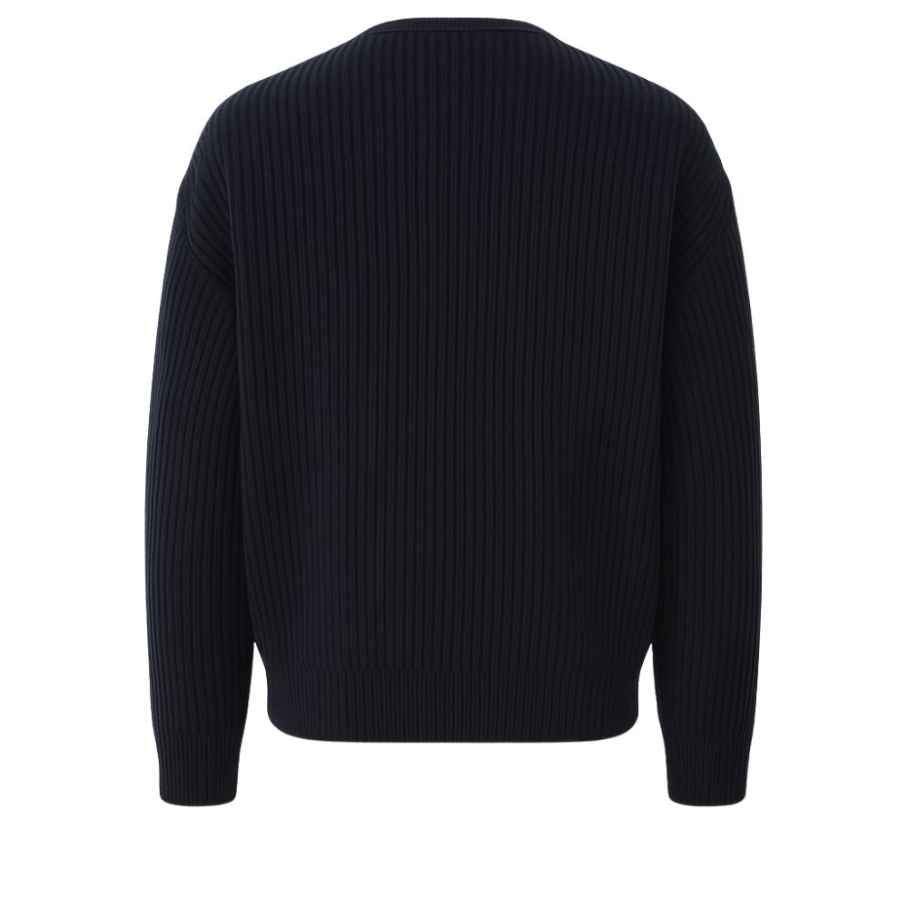 quiet luxury menswear," "minimalist layering piece," "structured knitwear," "transitional outerwear," "designer cardigan