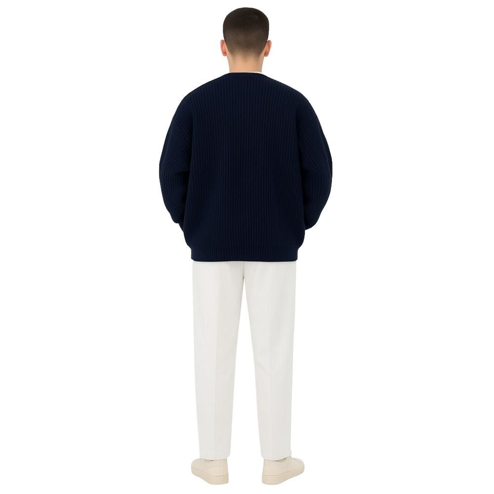 quiet luxury menswear," "minimalist layering piece," "structured knitwear," "transitional outerwear," "designer cardigan