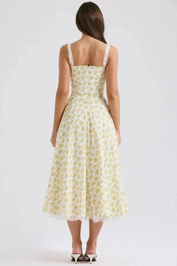 Kouvr's Aviva yellow floral vintage-inspired midi dress with sweetheart neckline and pockets