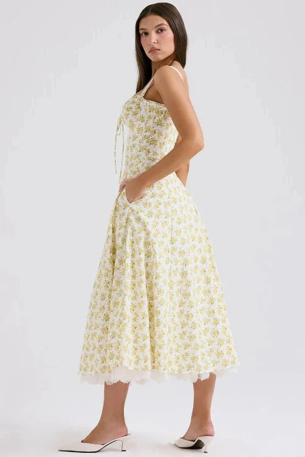 Kouvr's Aviva yellow floral vintage-inspired midi dress with sweetheart neckline and pockets