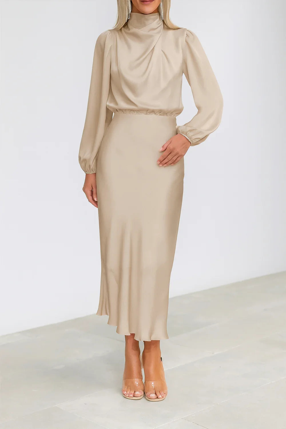 Model wearing Kouvr long sleeve beige satin midi dress with draped cowl neckline