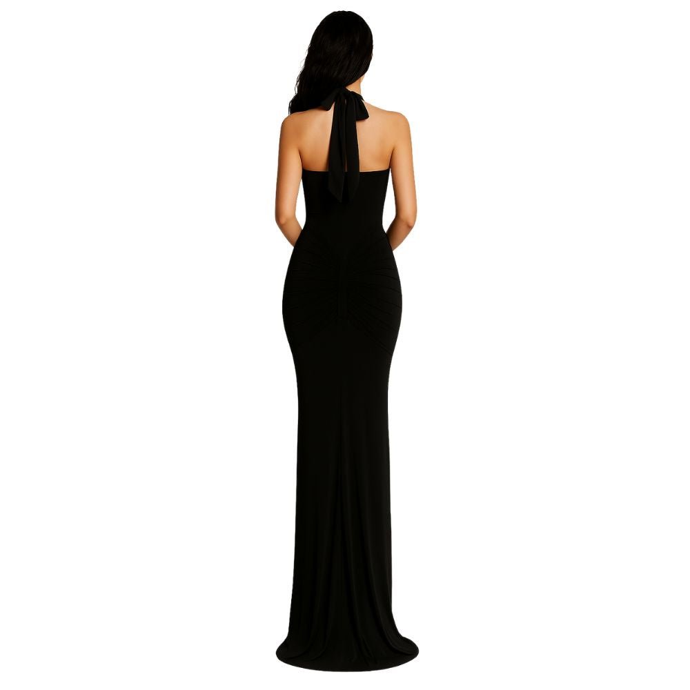 Model from behind in Kouvr black halter neck evening gown with ruching detail