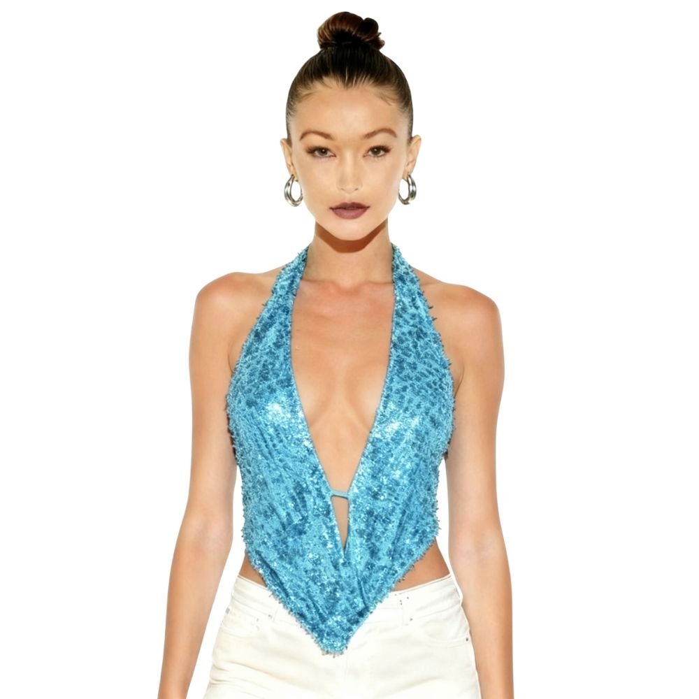 Woman wearing a blue kouvr sequin halter top on a white background