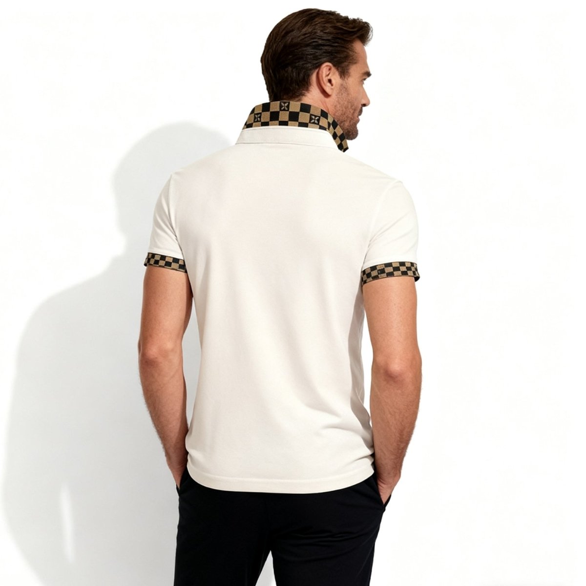 Back view of the Kouvr men's luxury polo in pink, highlighting the clean design and statement checkered collar.