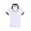 Product-only image of the white Kouvr Fashion polo shirt with checkered collar, laid flat to show the embroidered R logo and placket.