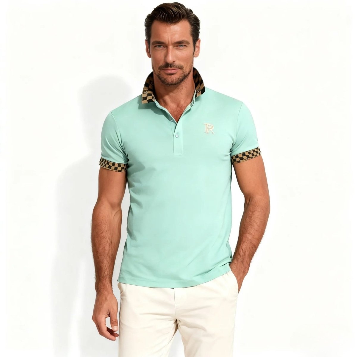 Man wearing the Kouvr Fashion Brent men's slim fit polo shirt in mint green with a designer checkerboard pattern on the collar and sleeve cuffs.