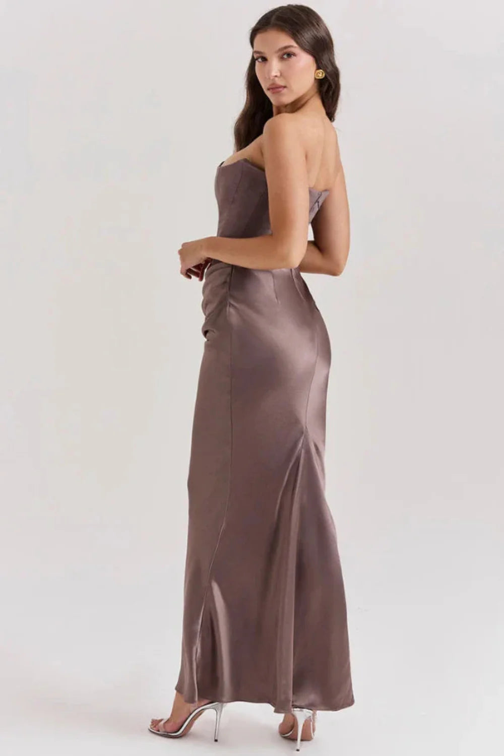sculptural," "figure-flattering," "boned bodice," "ruched hip detail," and "black-tie attire