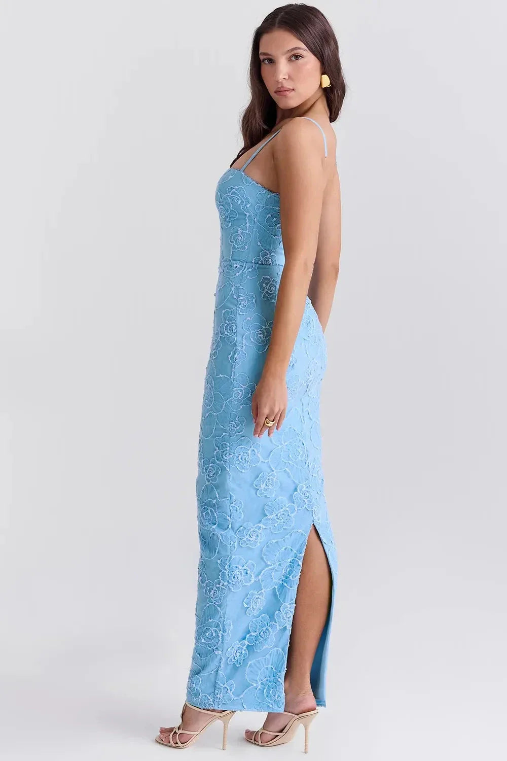 Model wearing Kouvr light blue floor-length gown with 3D floral embroidery