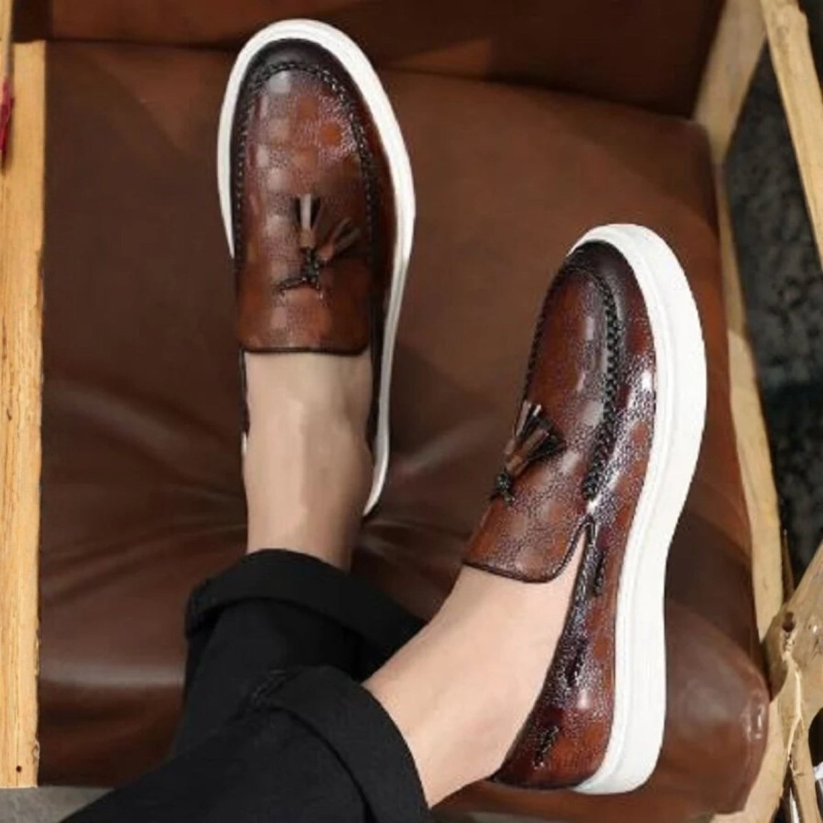 Model wearing the brown Kouvr Carlo embossed leather loafers with tailored trousers, demonstrating their smart casual versatility.