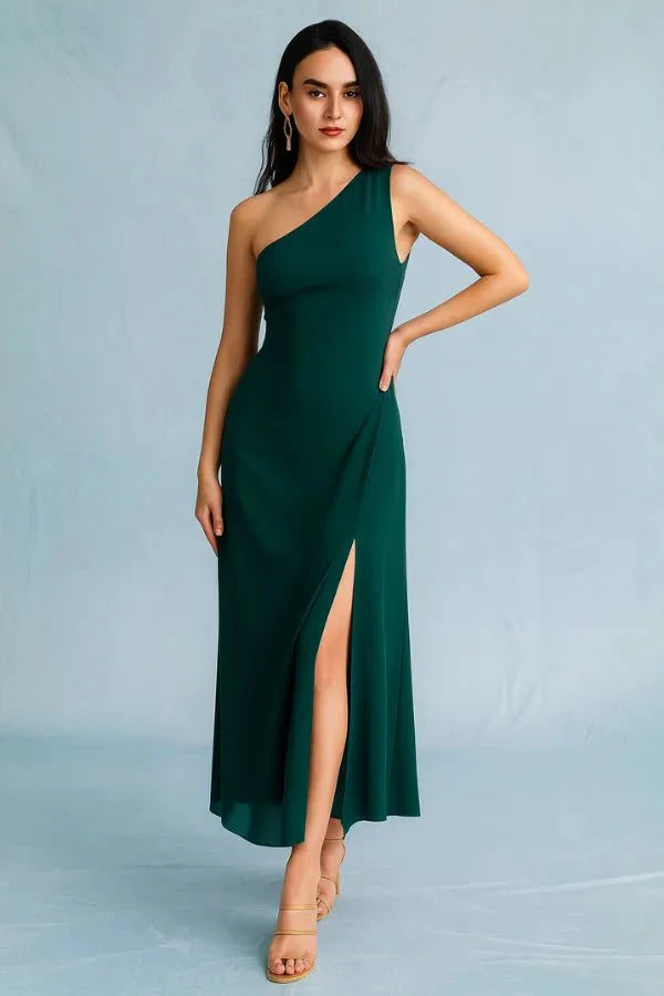 Kouvr Charel Gown in green featuring a one-shoulder neckline and thigh-high slit, worn by a model against a blue background
