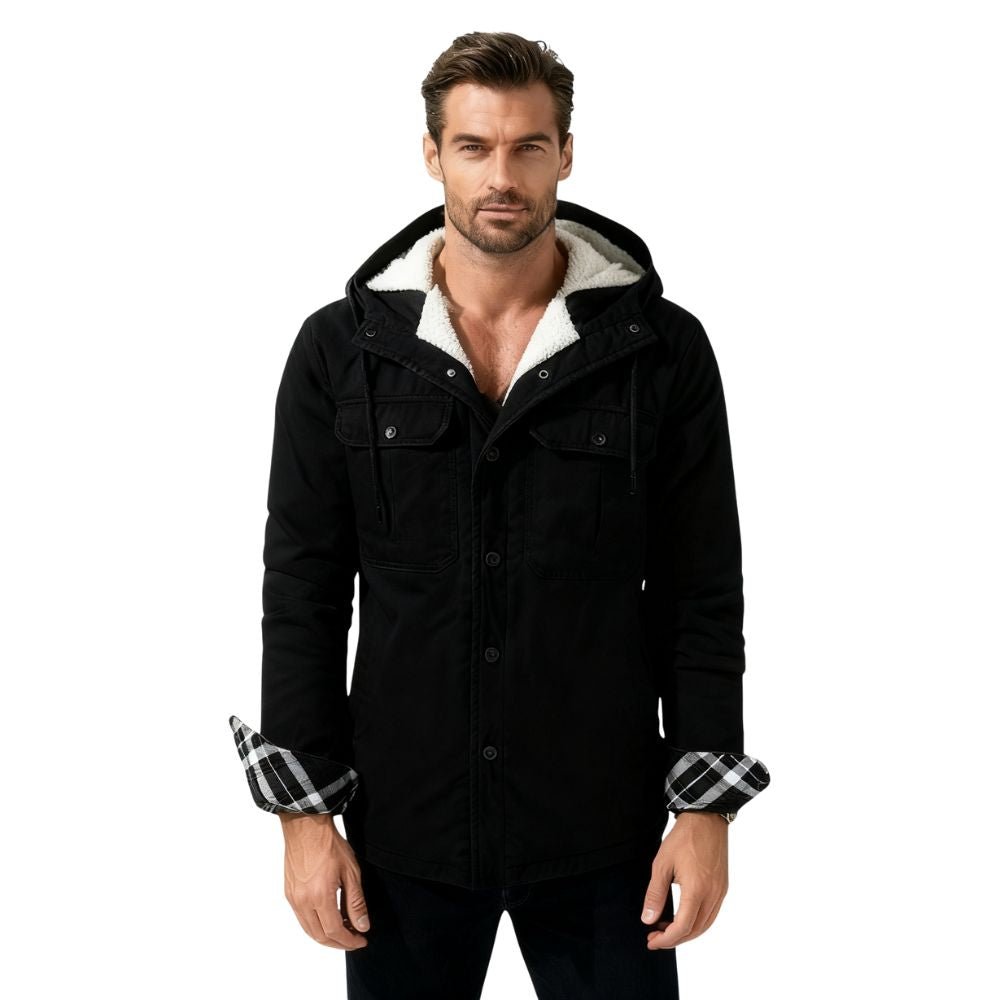 Man wearing a black kouvr coat with white lining on a white background