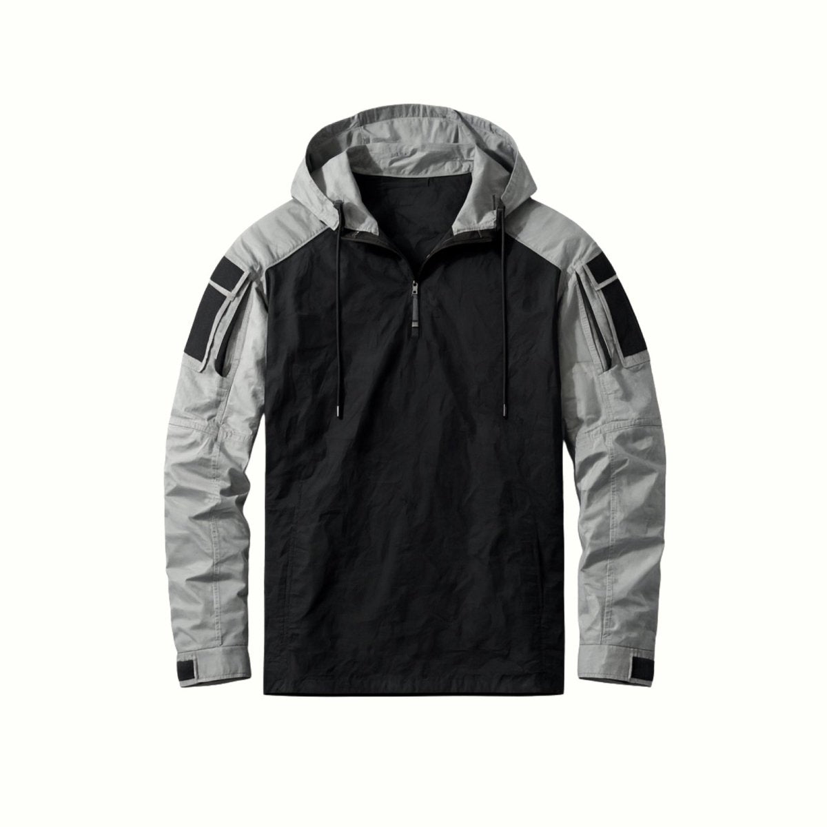 Flat lay product photo of the Kouvr Clint Tactical Anorak Jacket, showing the front with its half-zip, drawstrings, and sleeve pockets.