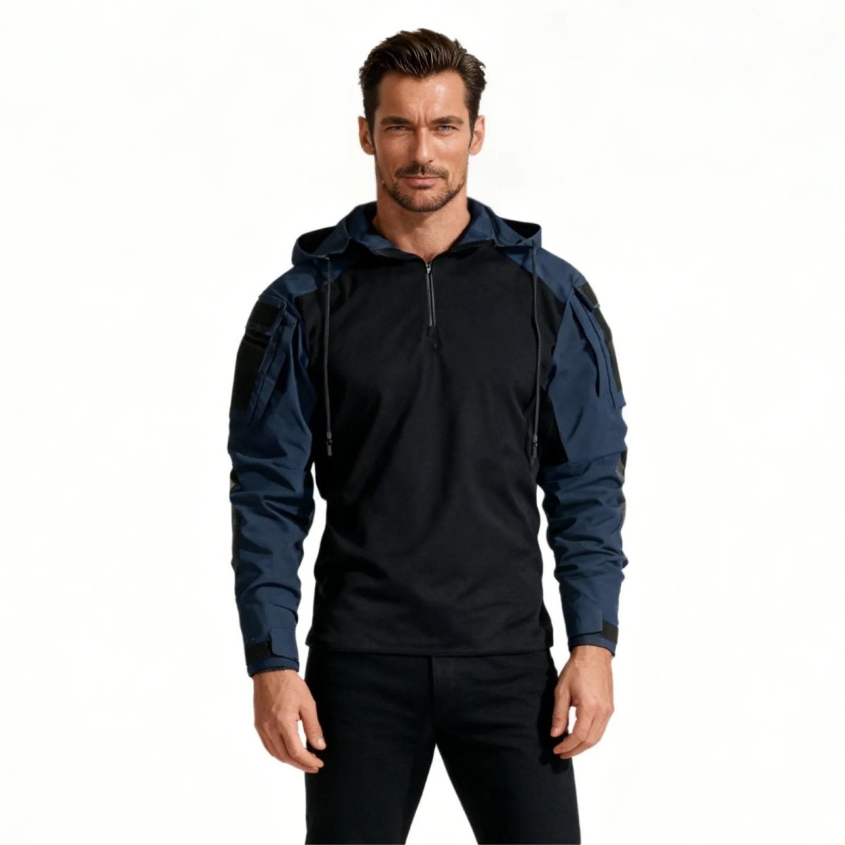 Man wearing the Kouvr Clint tactical combat hoodie in dark blue and black, shown from the front against a white background.