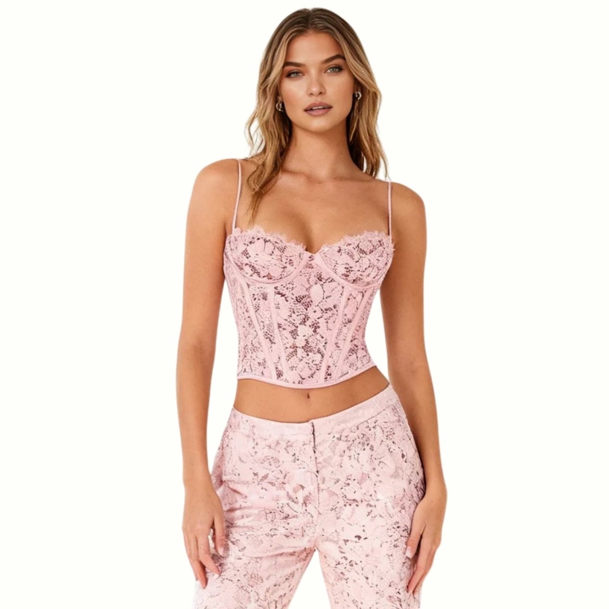 Woman wearing a pink Kouvr lace top on a white background