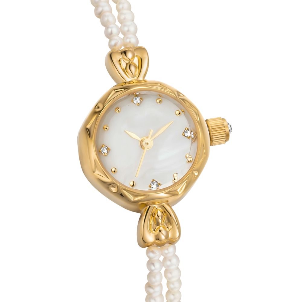 Gold kouvr watch with a pearl strap on a white background