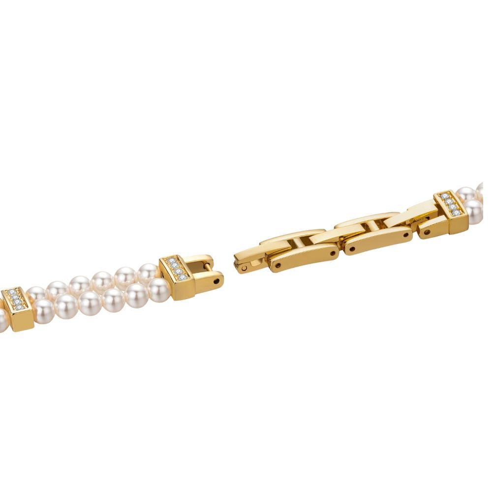 Gold kouvr bracelet with pearl-like beads on a white background