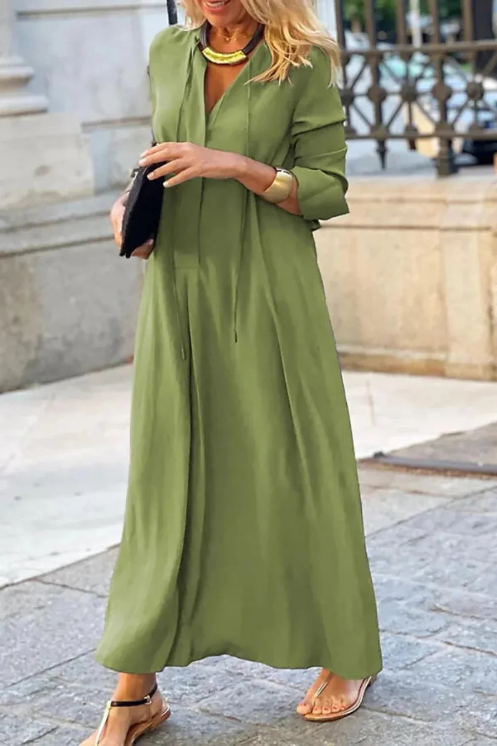 A-line silhouette', 'tie-neck gown', 'bohemian chic dress', 'vacation wear', 'comfortable elegant dress', and 'lightweight travel dress