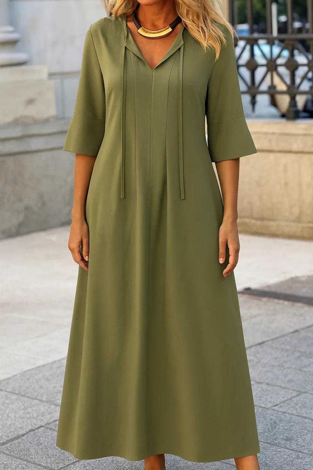 A-line silhouette', 'tie-neck gown', 'bohemian chic dress', 'vacation wear', 'comfortable elegant dress', and 'lightweight travel dress