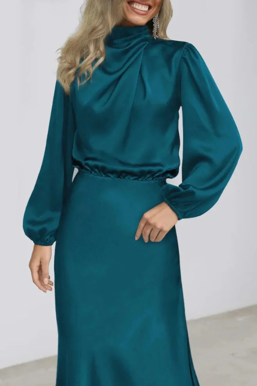 Model wearing the Kouvr Ellana elegant teal satin midi dress with bishop sleeves