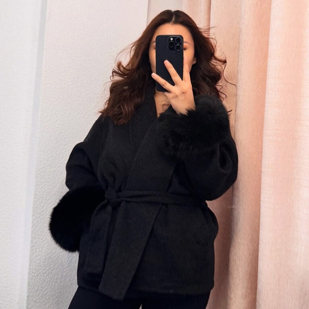 luxury winter outerwear", "designer belted coat", "women's evening coat", "statement sleeve coat", "cashmere blend jacket