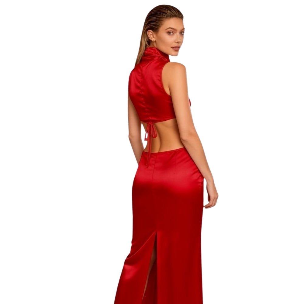 Back view of the Evelyn red satin set, detailing the open-back crop top with tie closures and the fit of the maxi skirt.