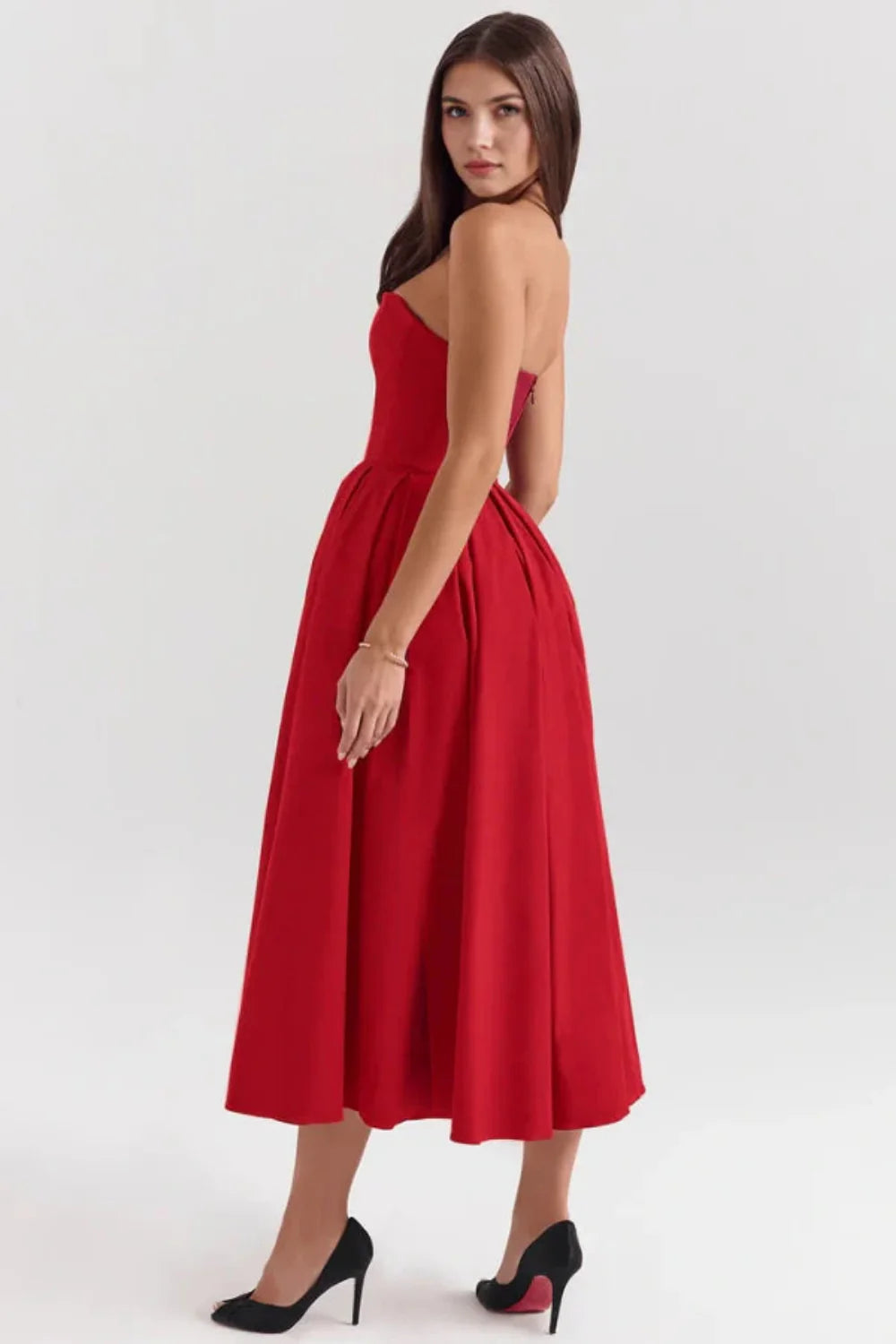 Model wearing the Kouvr Fashion Aneri red strapless formal midi dress