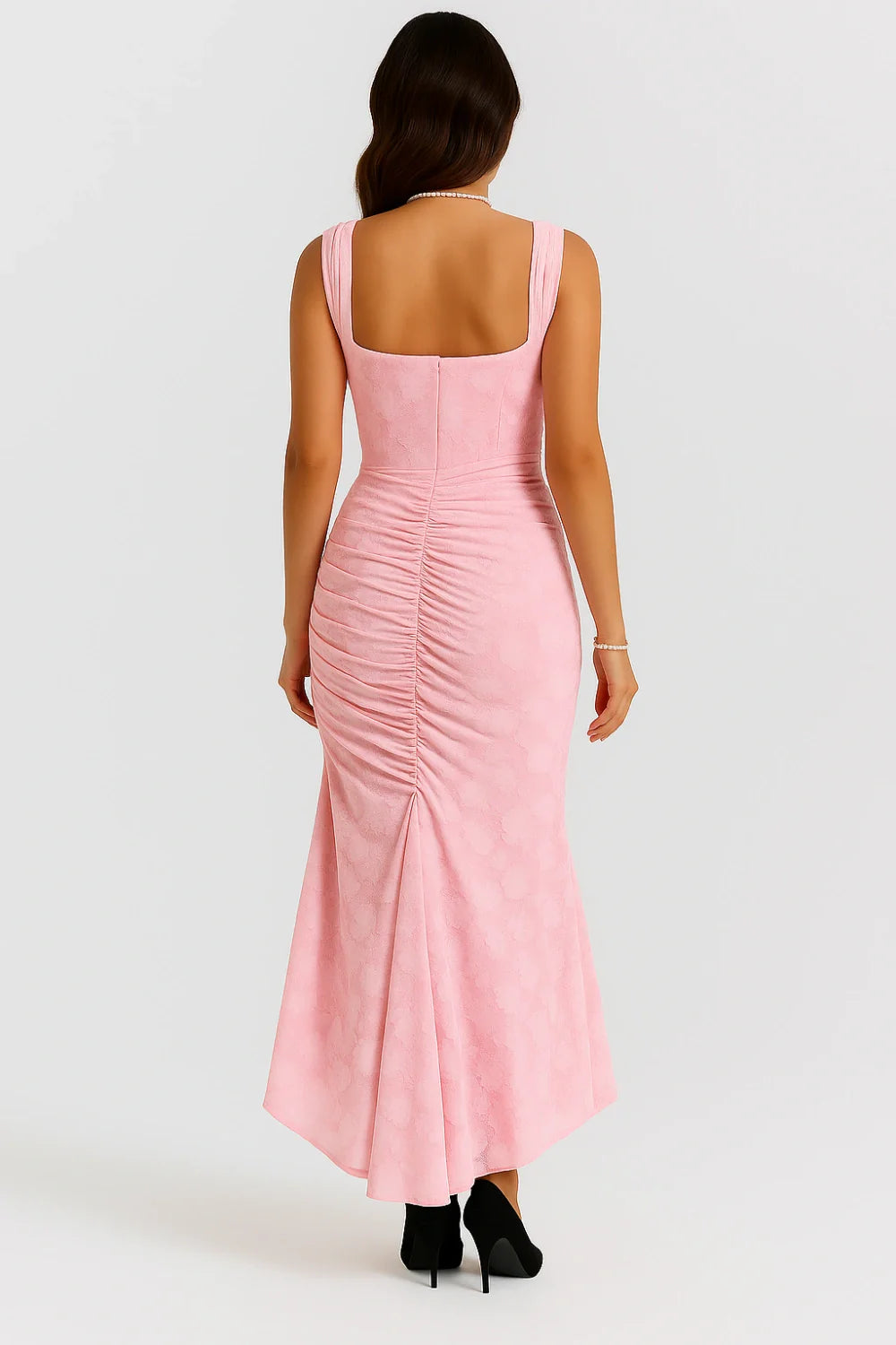 Model wearing Kouvr Arabella light pink corset midi dress with square neckline