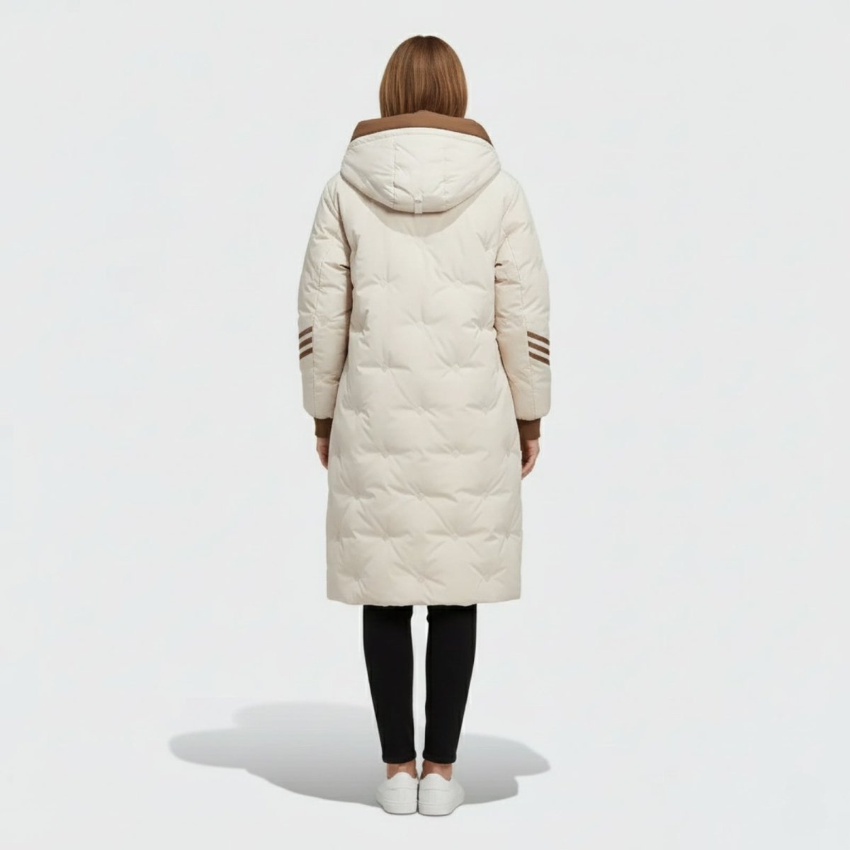 Back view of the Kouvr Fashion Arianne winter coat, highlighting the insulated brown hood and brown three-stripe detail on the sleeves.