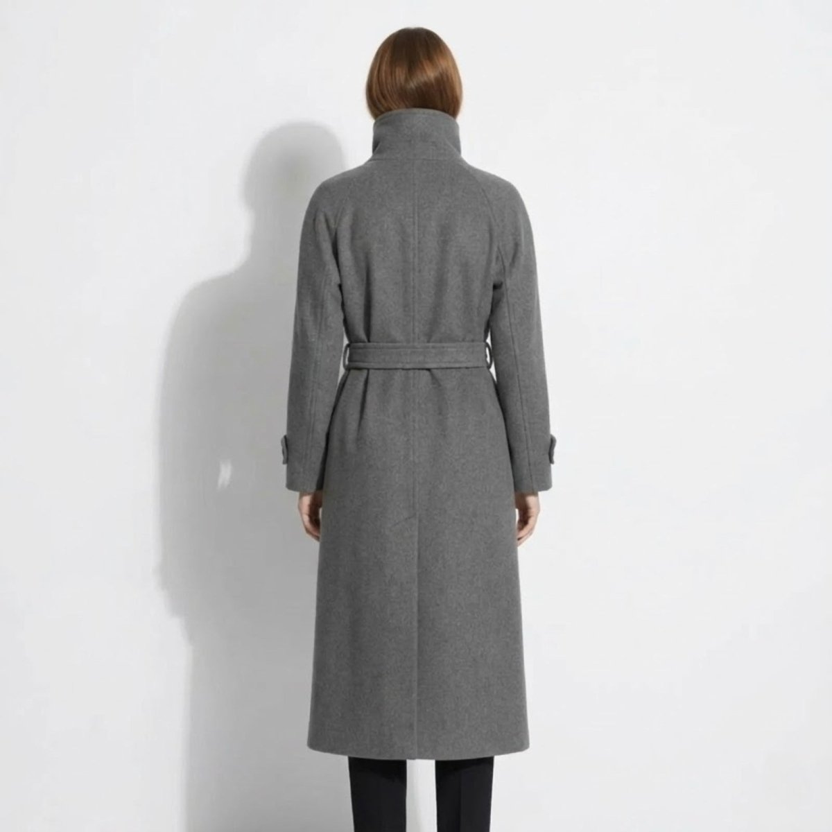Back view of the Kouvr Fashion Ashley coat in grey, showing the clean lines of the raglan sleeves and the detail of the belted waist.