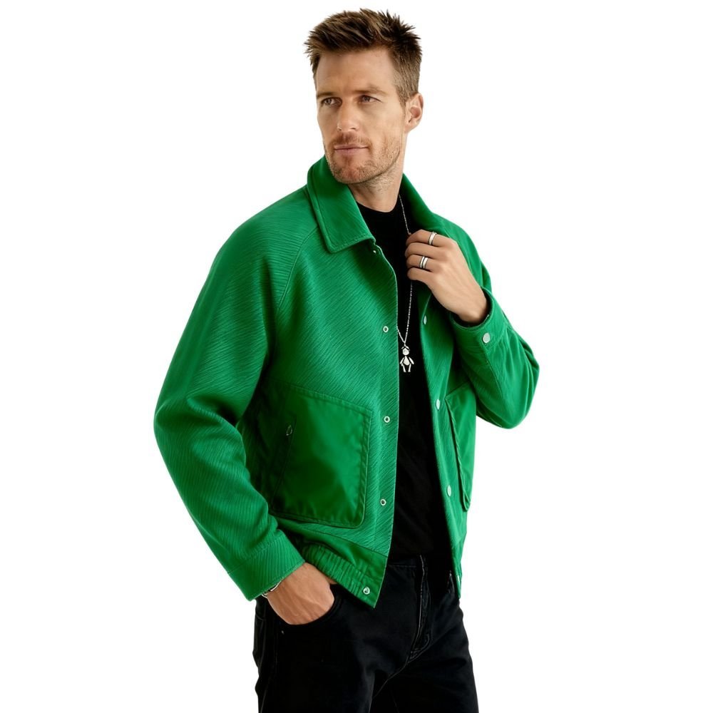 Man wearing a green kouvr jacket on a white background