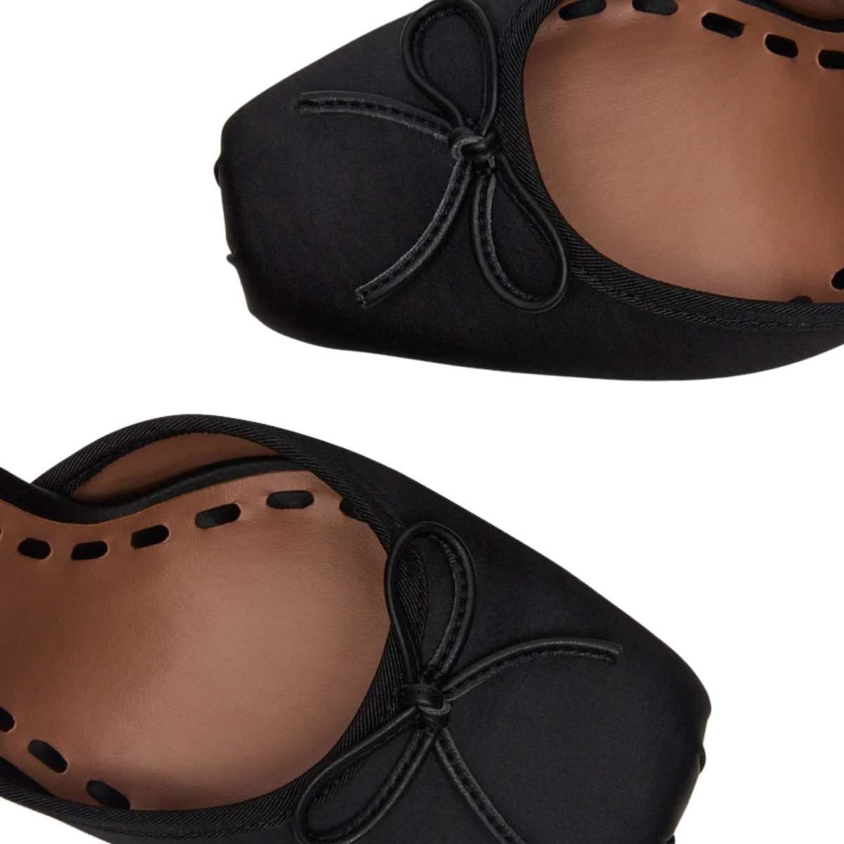 Black kouvr high-heeled shoes with white background