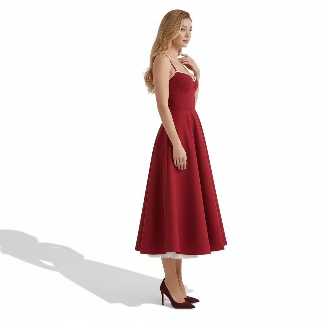 Side profile of Kouvr Fashion red A-line cocktail dress showing the full skirt and tulle underskirt.