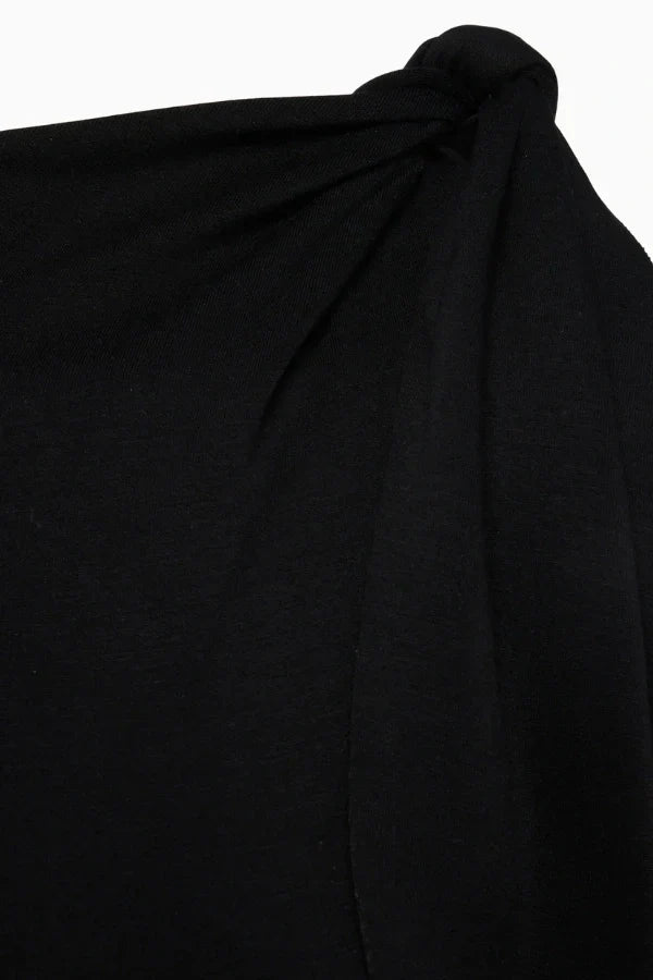 column silhouette," "draped shoulder," "floor-skimming hem," "minimalist aesthetic," "understated elegance