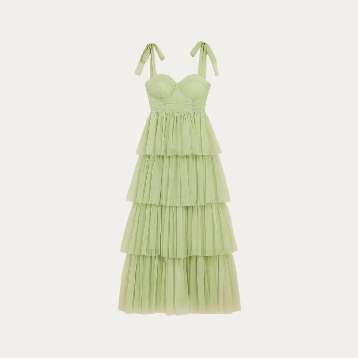 Light green Kouvr tiered dress with thin straps on a white background