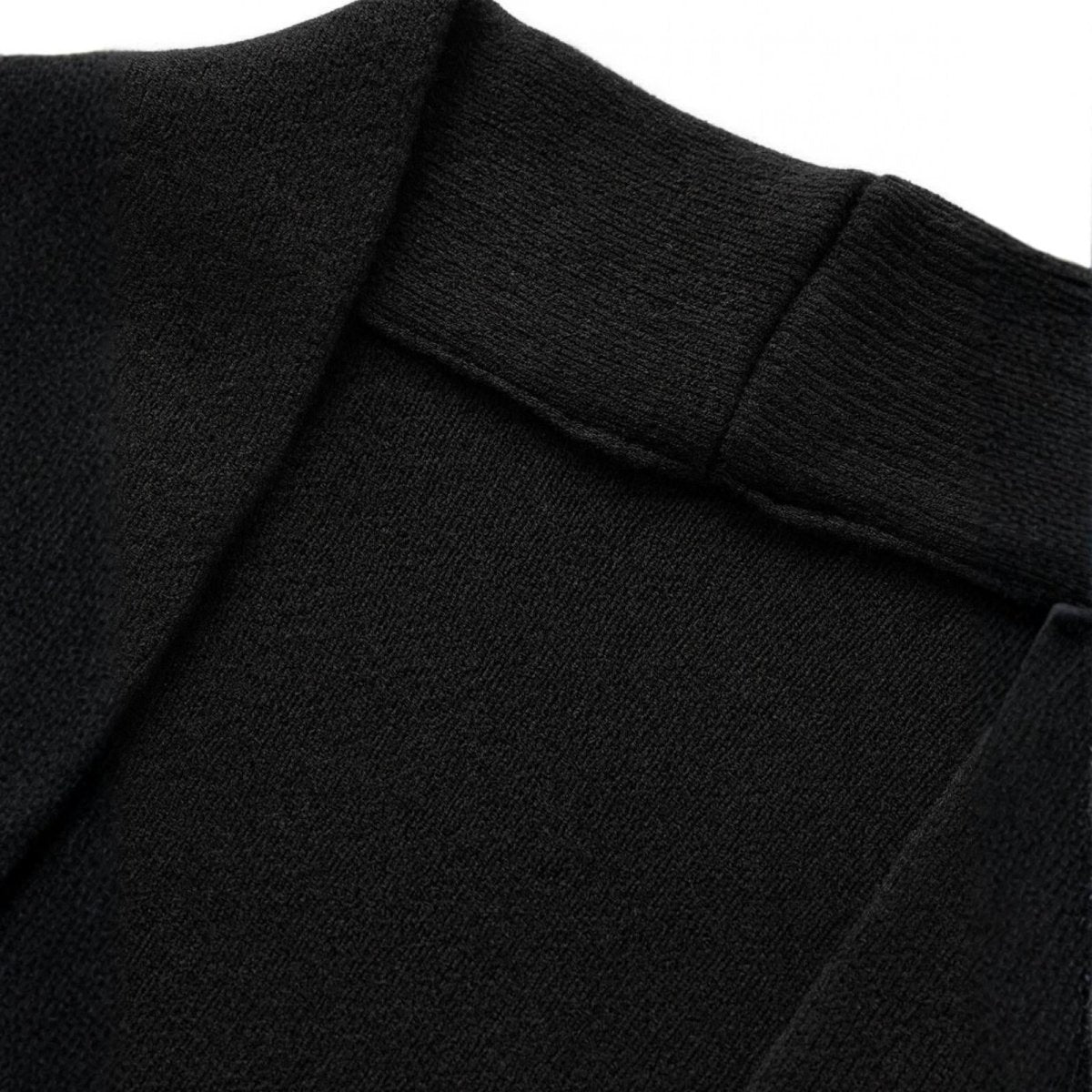 Close-up of a black cardigan with a collar on a white background