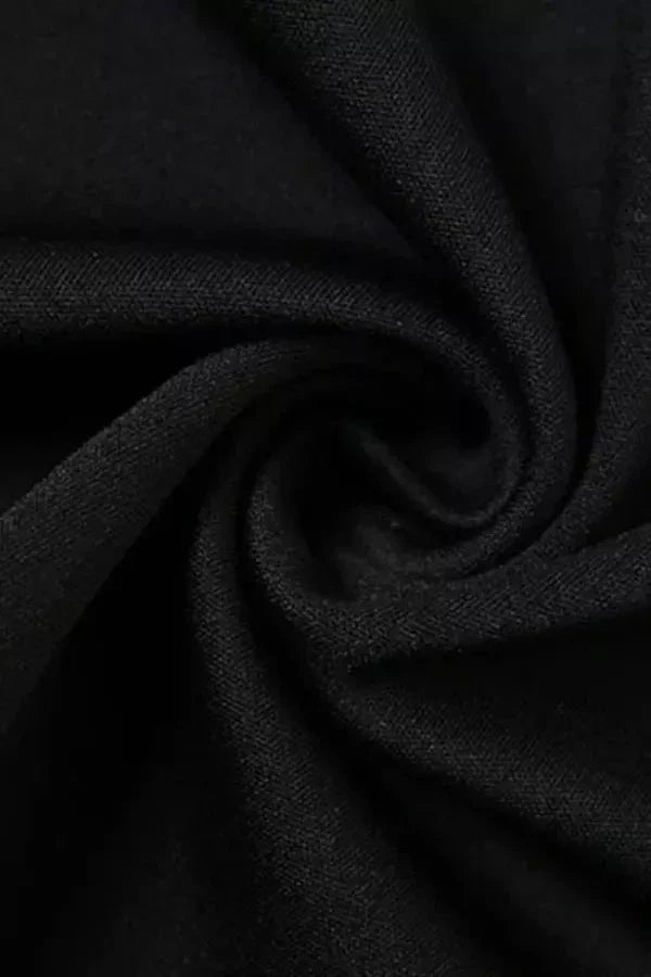 Model wearing Kouvr Fashion black corset mini dress with gold necklace