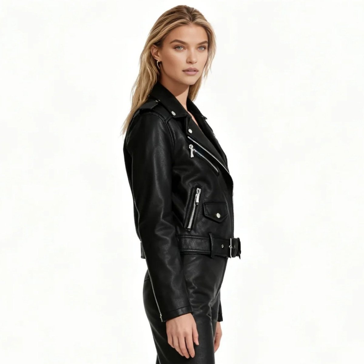 Side profile of a woman wearing the Kouvr Fashion black faux leather moto jacket, showcasing the belted waist and sleeve zipper details.