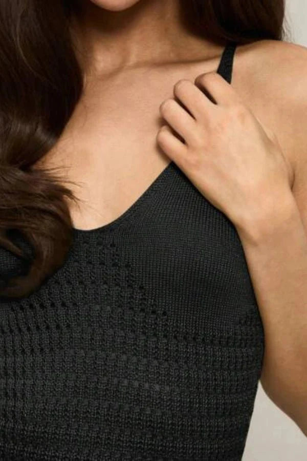 flounce detail," "pointelle weave," "sleeveless," "figure-hugging," and "evening silhouette