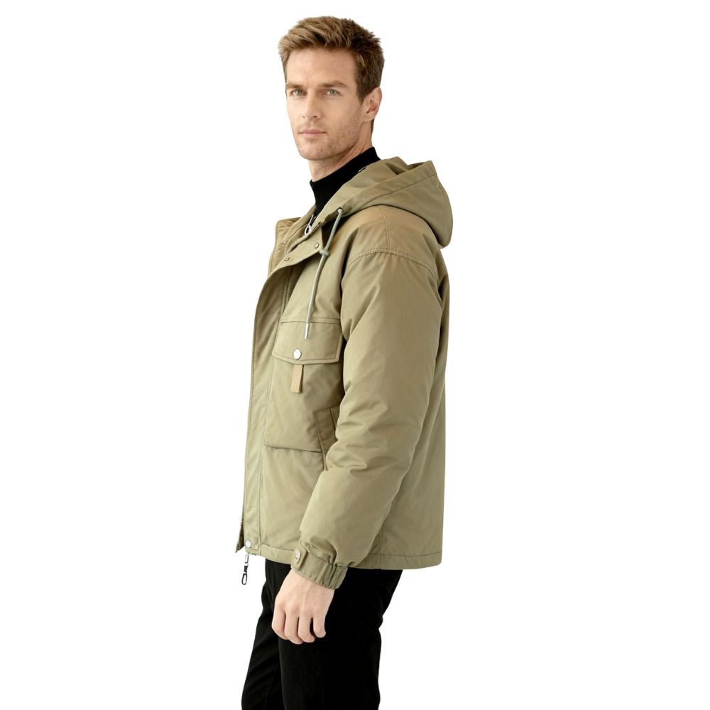 Man wearing the Kouvr Fashion Urbanite Technical Parka in Green over a black turtleneck