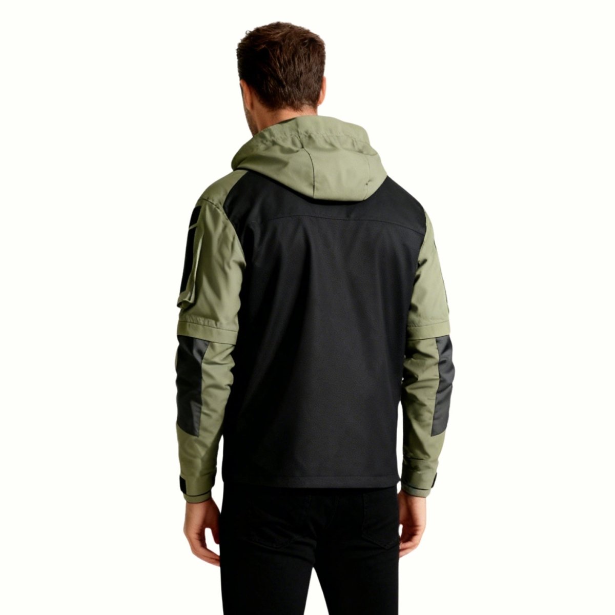 Back profile of the Kouvr Fashion Clint men's tactical jacket in dark green, highlighting the ripstop sleeve construction and utility patch panels.