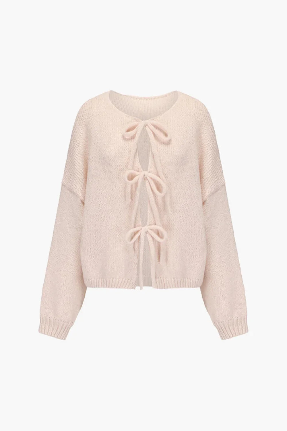 coquette sweater," "balletcore knit," "luxury knitwear," "oversized cardigan," "V-neck sweater," and "soft cozy knit